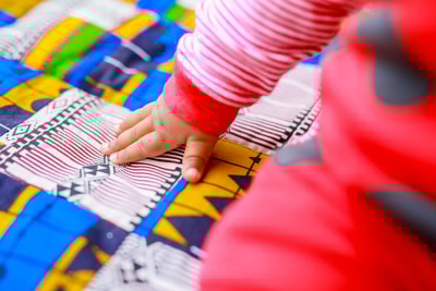 custom made playmat made with different patches of Kitenge