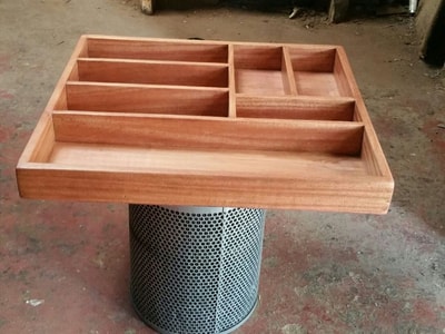 Cutlery tray of wood for a kitchen drawer within custom made realization