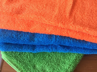Custom made hand towels with Kitenge border within custom made realization