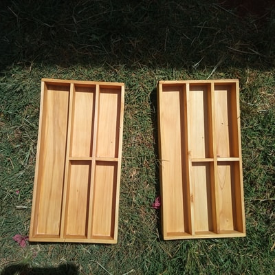 two custom made wooden cutlery inserts within custom made realization