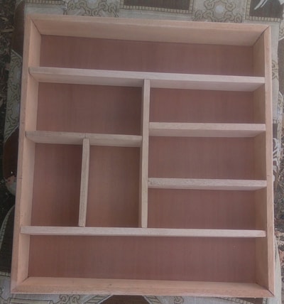Custom made wooden drawer insert for cutlery within custom made realization