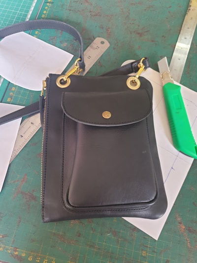 custom made small shoulder bag made of leather within custom made realization