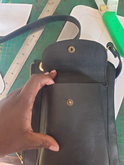 custom made small shoulder bag made of leather within custom made realization