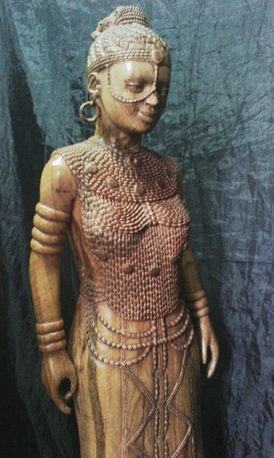 Buddha sculpture (female and African) within custom made realization
