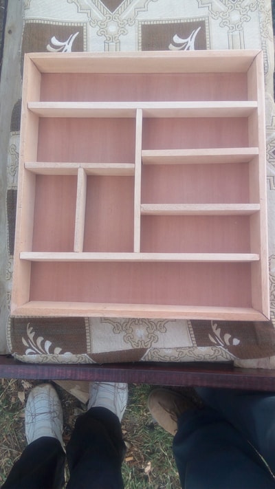 Custom made wooden drawer insert for cutlery within custom made realization