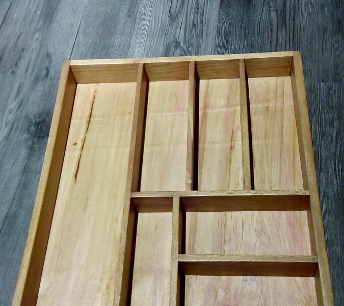 Cutlery tray of wood for a kitchen drawer