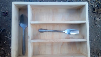 Custom made cutlery box within custom made realization