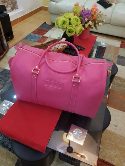 Custom made pink travel bag which can double up as a gym bag within custom made realization