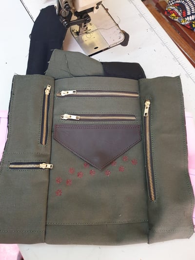 custom made shoulder bag: green fabric with dog paw print within custom made realization