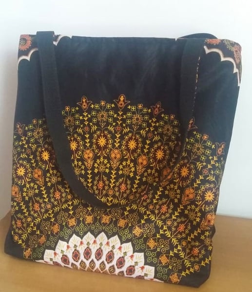 Custom made large handbag into which a 17 inch laptop fits.