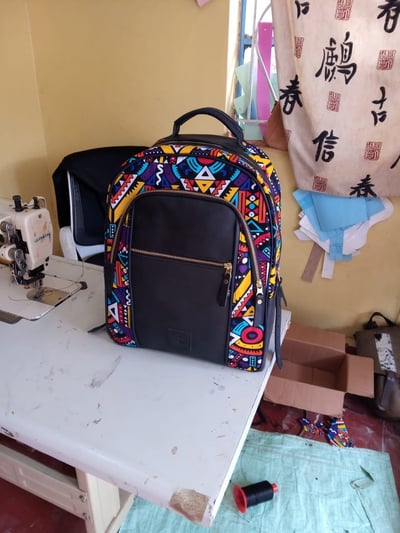 custom made fabric backpack with an extra compartment within custom made realization