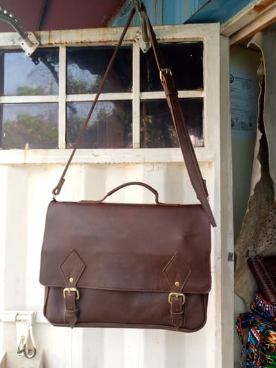 Custom made leather sling bag within custom made realization