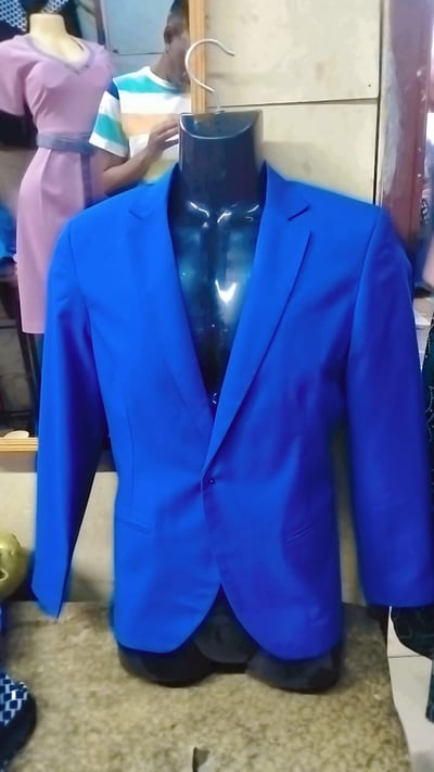 Custom made azure blue tailored pantsuit within custom made realization