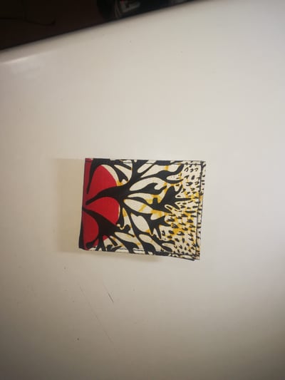 Custom-made leather wallet with a colourful African pattern within custom made realization