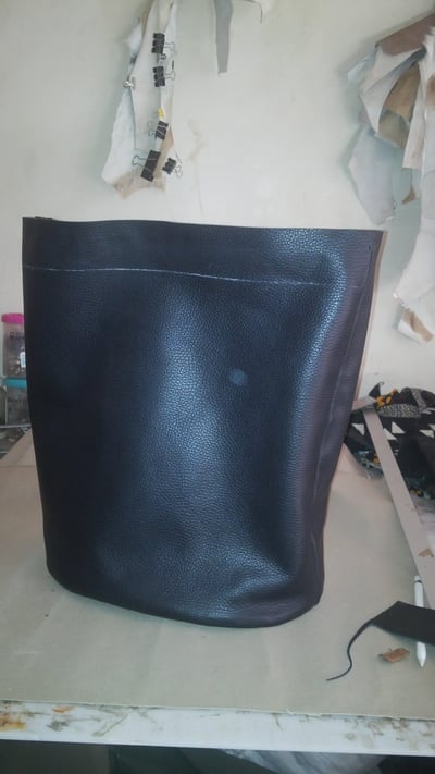 Custom made black leather handbag within custom made realization