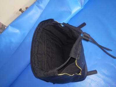 Custom made black leather back pack within custom made realization