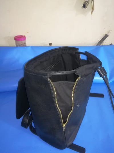 Custom made black leather back pack within custom made realization