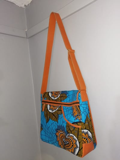 Custom made messenger bag about 25 cm high and 40 cm wide within custom made realization