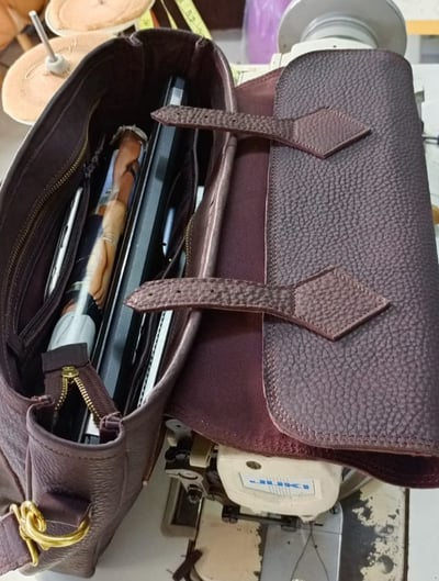Tailor-made male field leather bag for a laptop within custom made realization