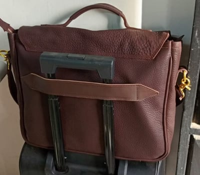 Tailor-made male field leather bag for a laptop within custom made realization