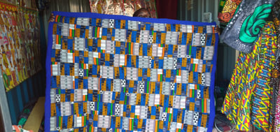 custom made playmat made with different patches of Kitenge within custom made realization