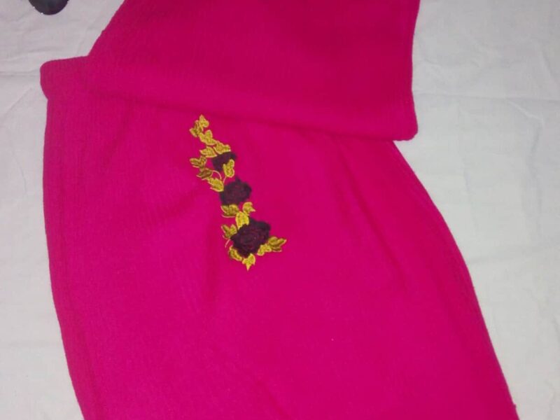 Knitted pink skirt set. With Gold and black flowers