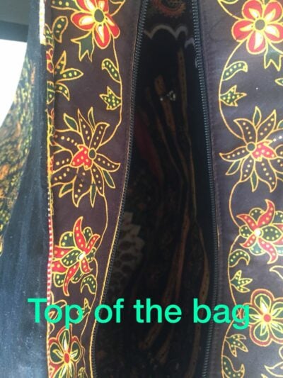 Custom made large handbag into which a 17 inch laptop fits. within custom made realization