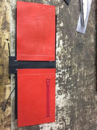 Custom made black and red wallet within custom made realization