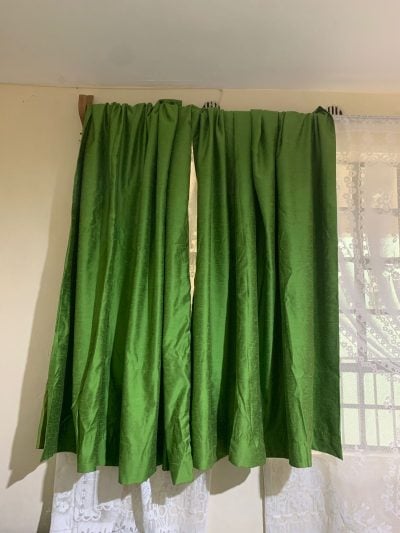 Tailored curtain in may green, opaque within custom made realization