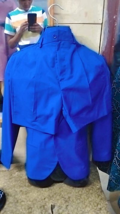Custom made azure blue tailored pantsuit within custom made realization