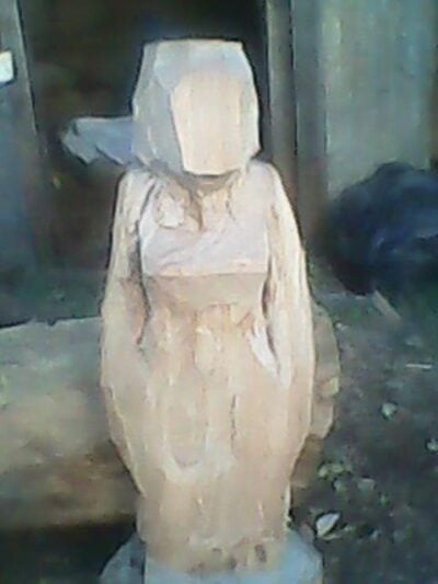 Buddha sculpture (female and African) within custom made realization