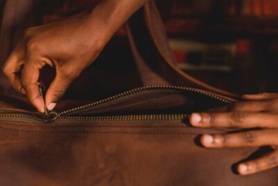 A light tan leather duffle bag - 2 Short straps within custom made realization